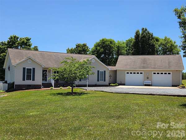 5.79 Acres of Land with Home for Sale in Locust, North Carolina