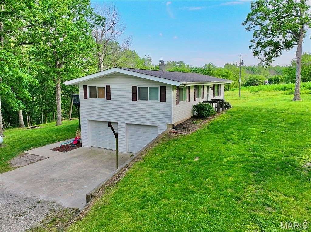 4.9 Acres of Land with Home for Sale in Boonville, Missouri