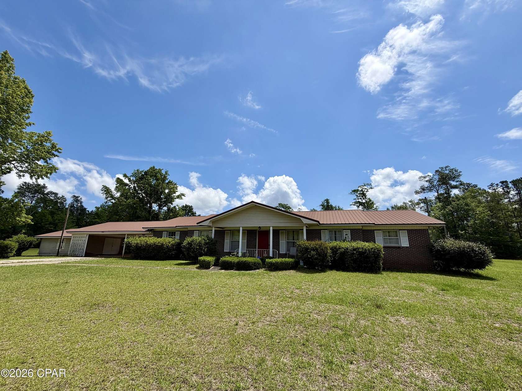 2.62 Acres of Land with Home for Sale in Grand Ridge, Florida
