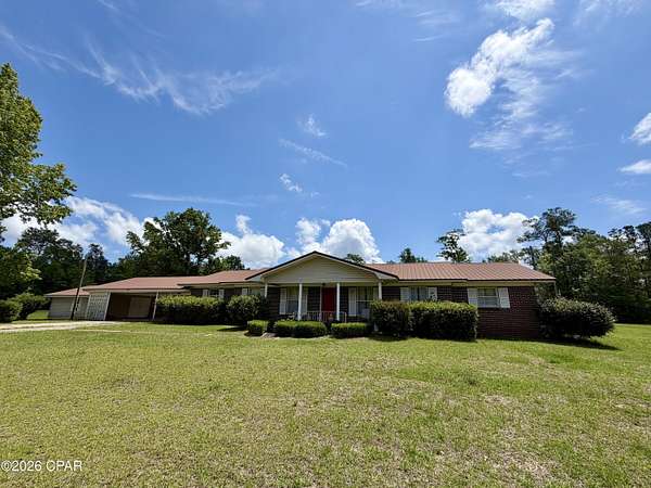 2.62 Acres of Land with Home for Sale in Grand Ridge, Florida
