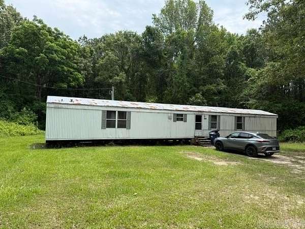 5.4 Acres of Land with Home for Sale in Junction City, Arkansas