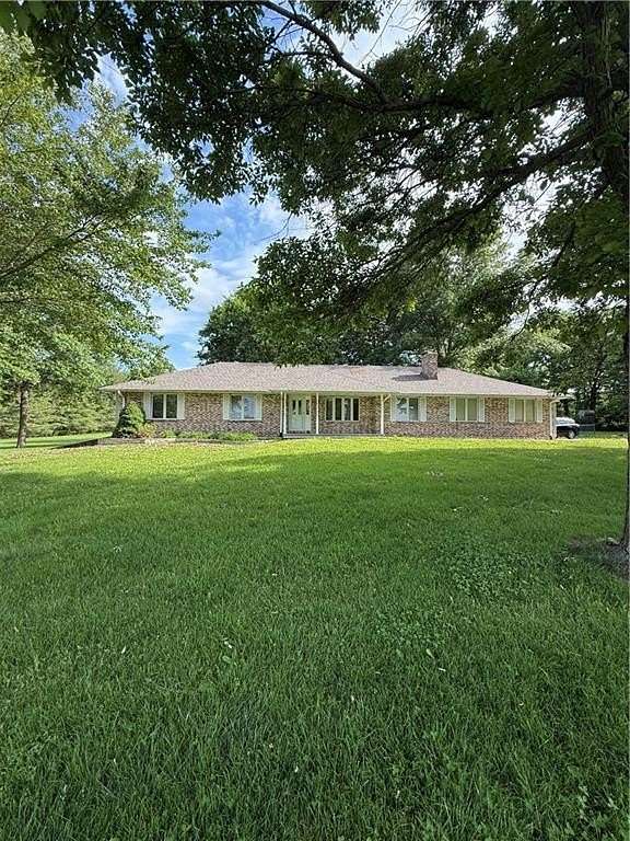 9.49 Acres of Land with Home for Sale in Oak Grove, Missouri