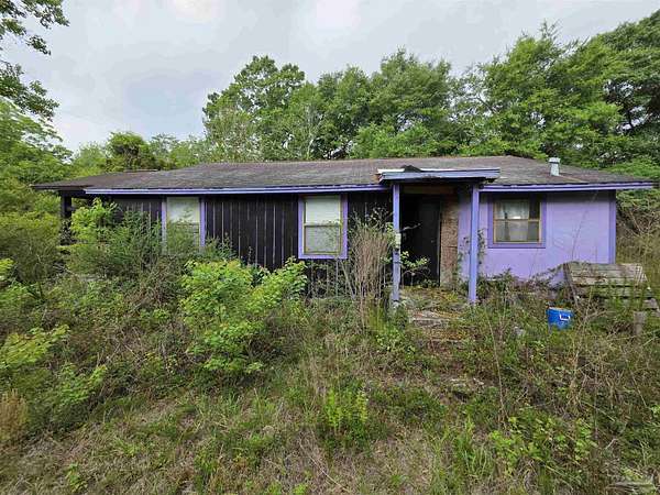 1.69 Acres of Land with Home for Sale in Milton, Florida