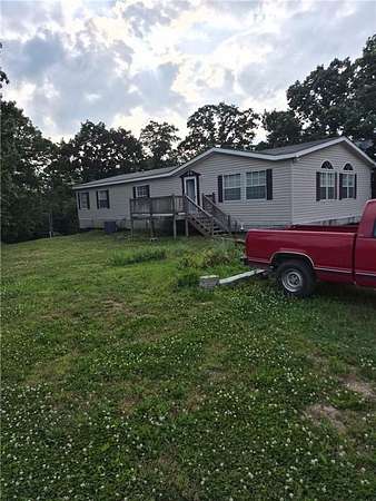 13.8 Acres of Land with Home for Sale in Cross Timbers, Missouri