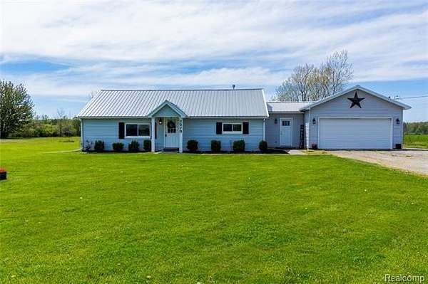 3 Acres of Land with Home for Sale in Riley Township, Michigan