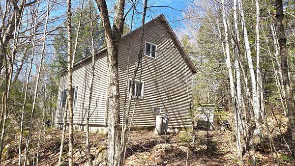 22.8 Acres of Recreational Land with Home for Sale in Lakeville Town, Maine