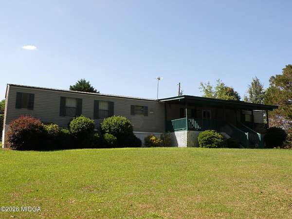 6.78 Acres of Land with Home for Sale in Haddock, Georgia