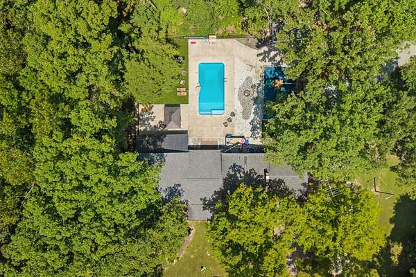 8.73 Acres of Land with Home for Sale in Holladay, Tennessee