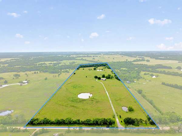 33 Acres of Land with Home for Sale in Wolfe City, Texas