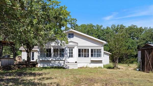 64.7 Acres of Agricultural Land with Home for Sale in Bluff Dale, Texas