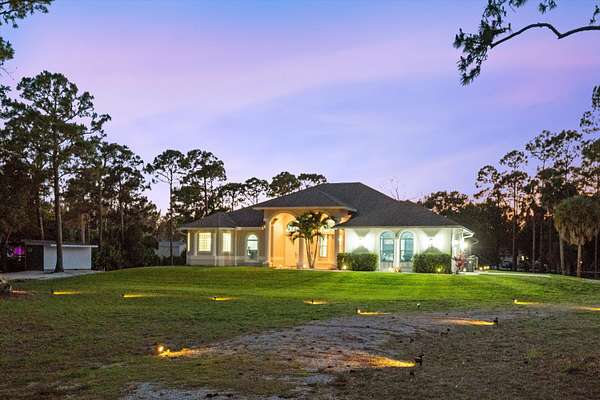 2.5 Acres of Land with Home for Sale in The Acreage, Florida