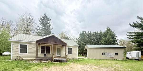1.5 Acres of Land with Home for Sale in Bitely, Michigan