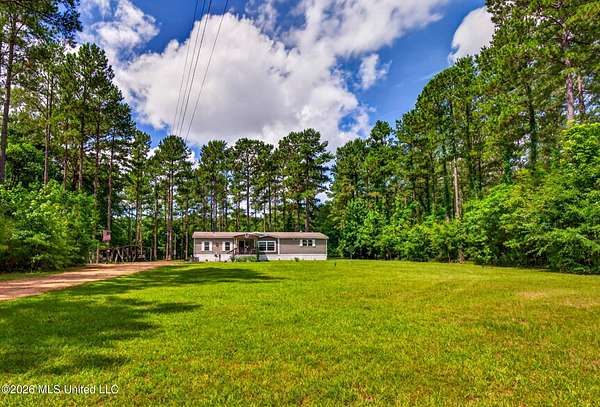 13.5 Acres of Recreational Land with Home for Sale in Columbia, Mississippi