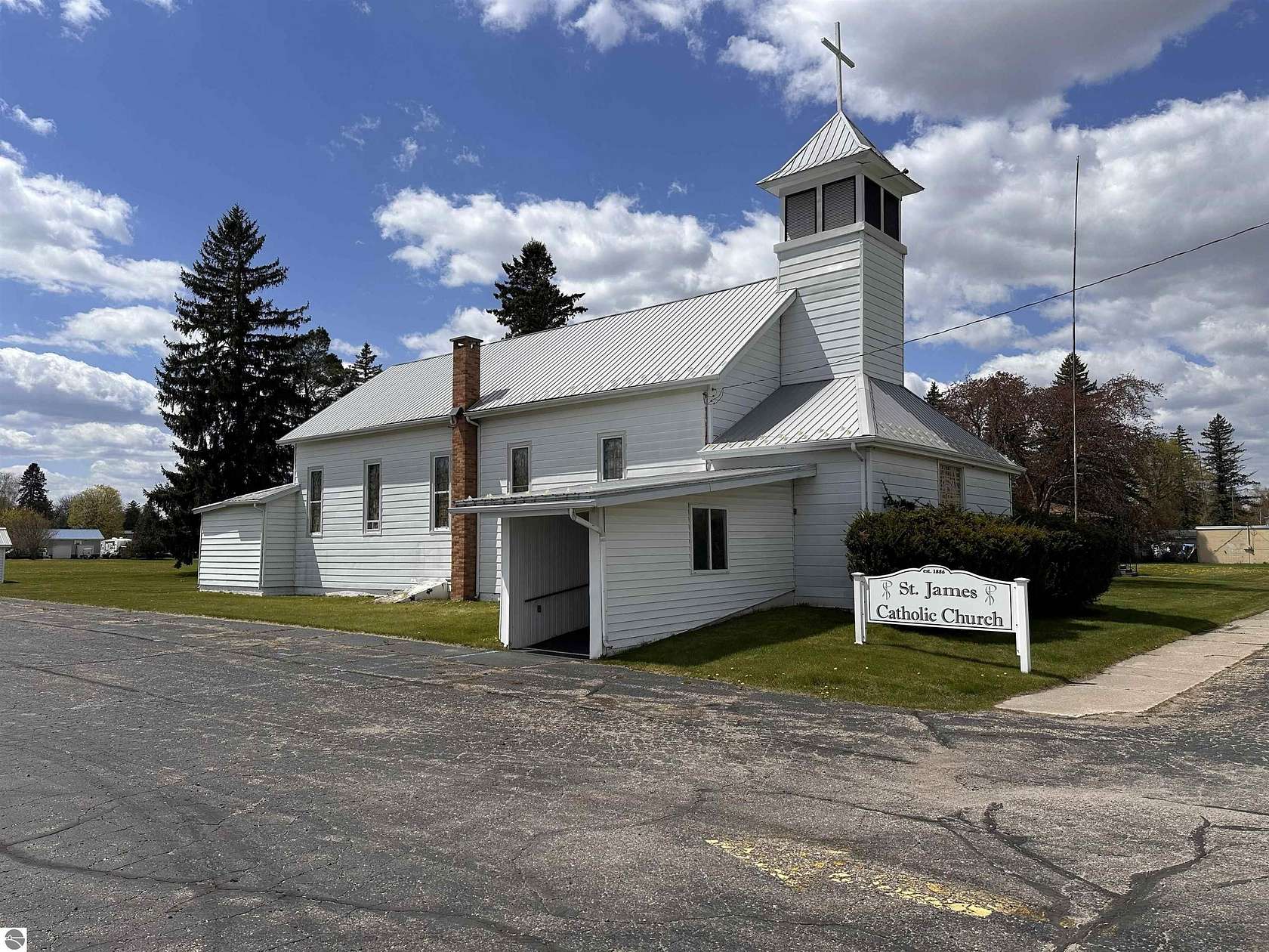 11.5 Acres of Improved Commercial Land for Sale in Whittemore, Michigan