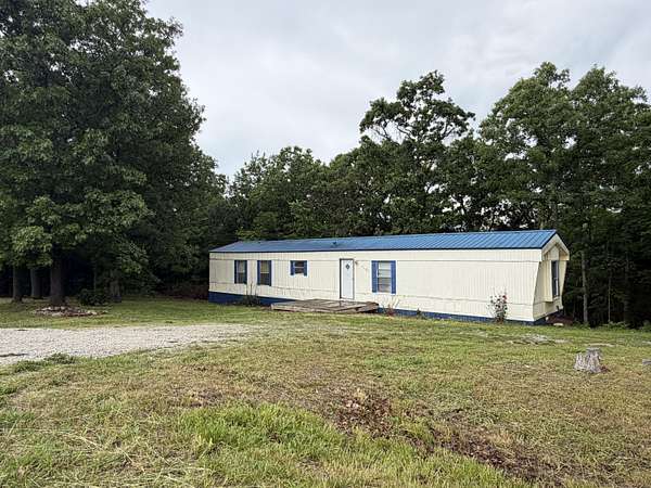 3.86 Acres of Land with Home for Sale in Goodson, Missouri