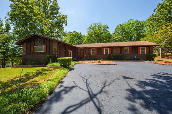 23.5 Acres of Recreational Land with Home for Sale in Darden, Tennessee