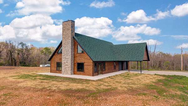 61.9 Acres of Recreational Land with Home for Sale in Crane, Missouri