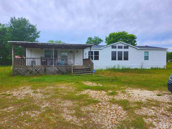 6.65 Acres of Land with Home for Sale in McDavid, Florida
