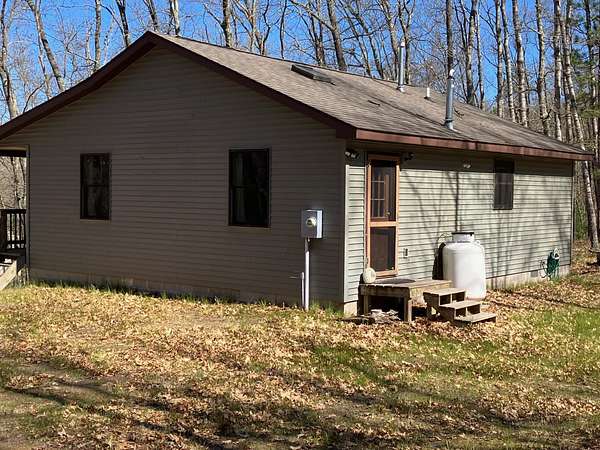 11.3 Acres of Recreational Land with Home for Sale in Baldwin, Michigan