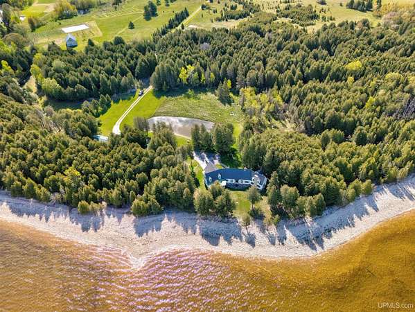 42 Acres of Recreational Land with Home for Sale in Garden, Michigan