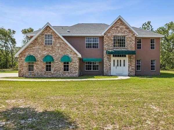 2.35 Acres of Land with Home for Sale in Spring Hill, Florida
