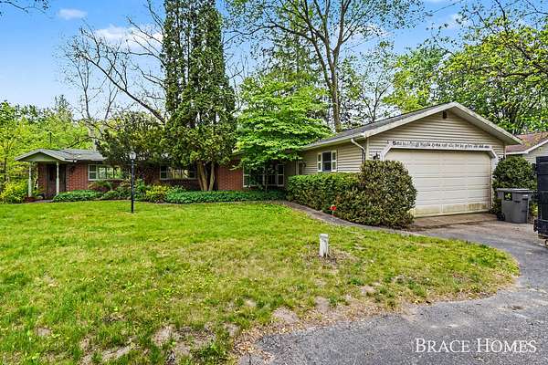 1.5 Acres of Land with Home for Sale in Alto, Michigan