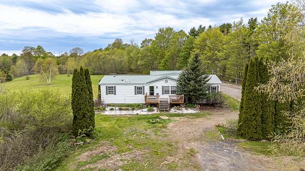 12.2 Acres of Land with Home for Sale in Dover-Foxcroft, Maine