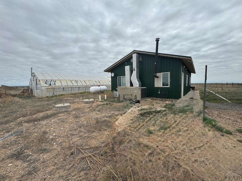 40 Acres of Agricultural Land with Home for Sale in Boone, Colorado