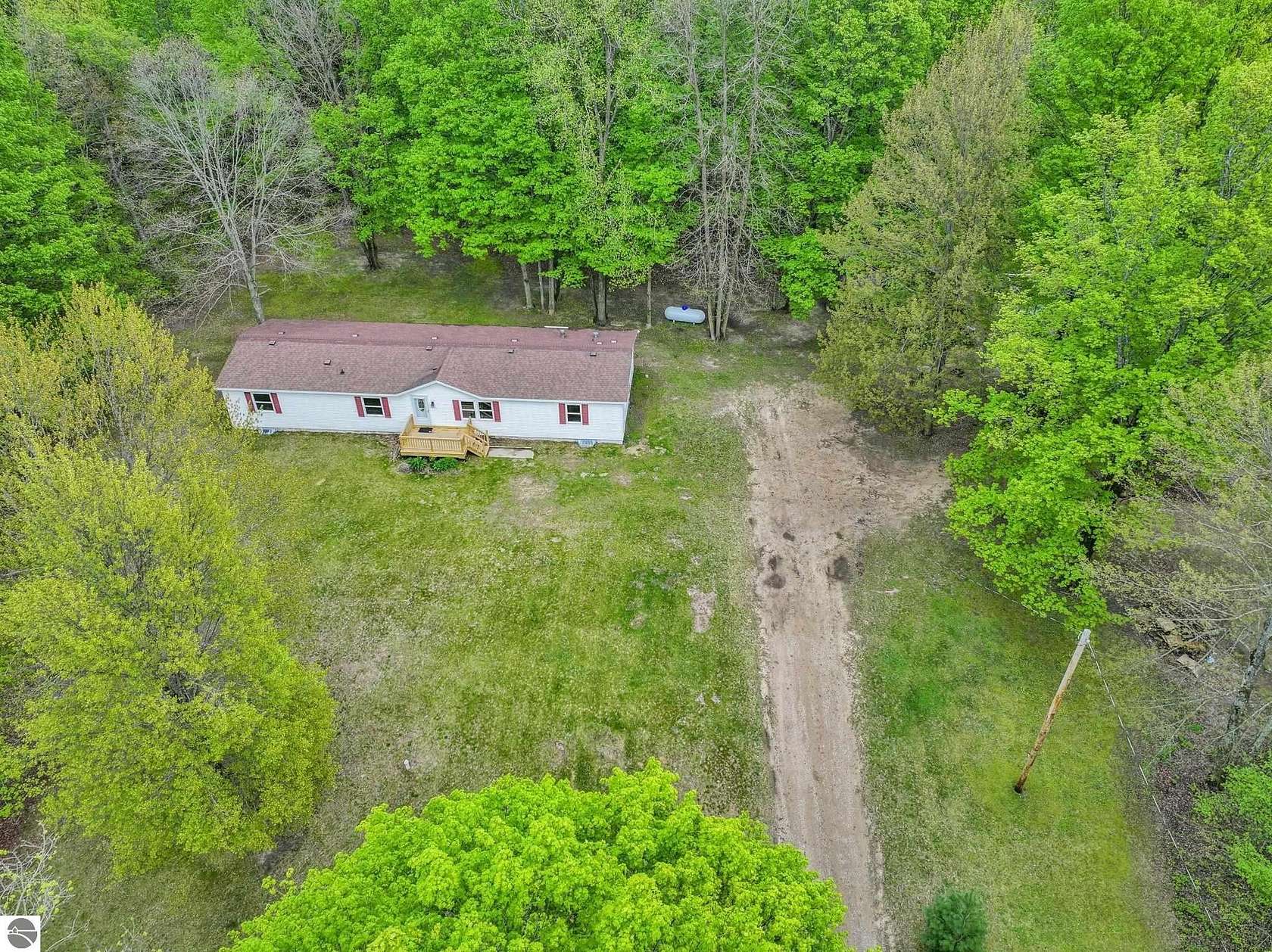 3 Acres of Land with Home for Sale in Mesick, Michigan