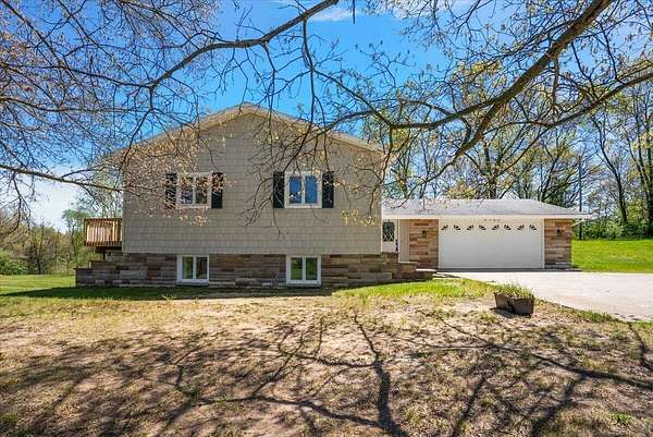 4 Acres of Land with Home for Sale in Rockford, Michigan