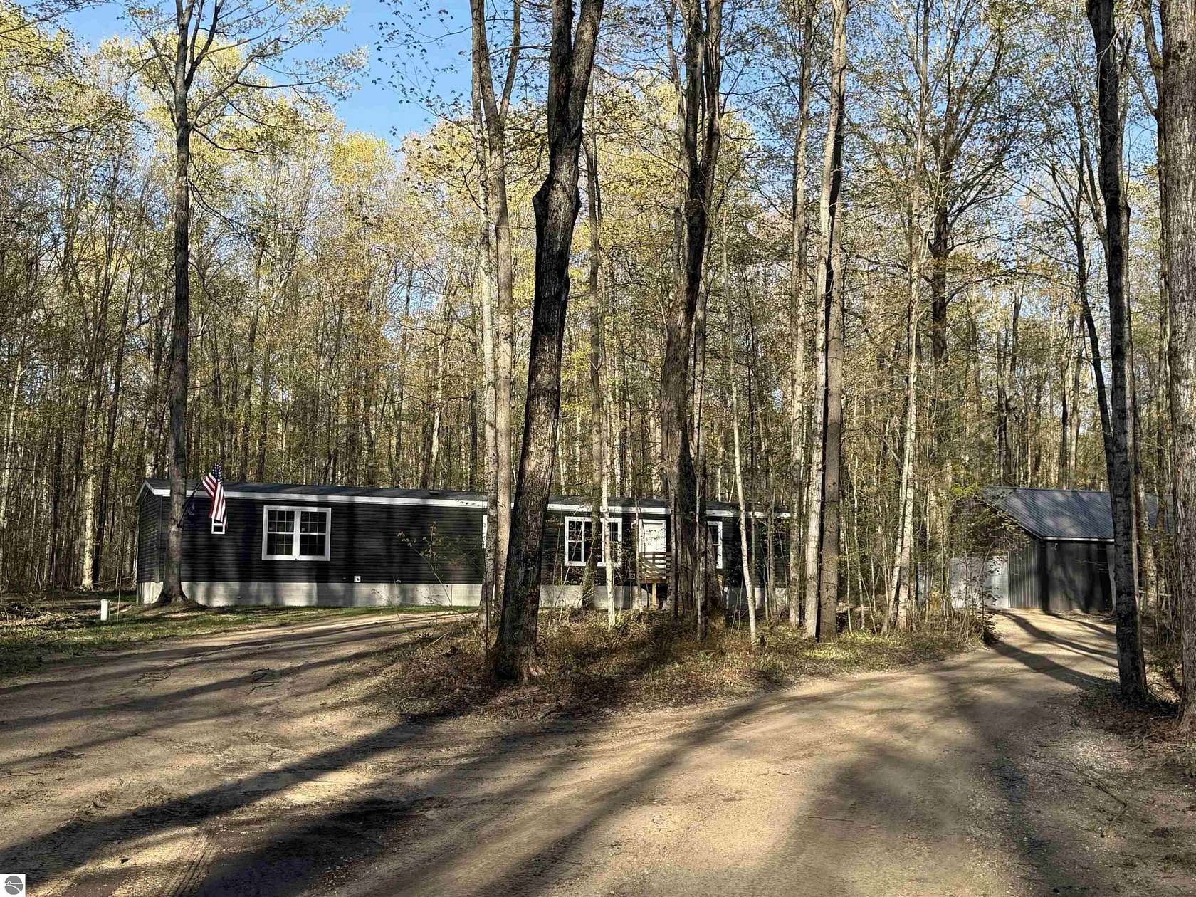 10 Acres of Recreational Land with Home for Sale in Mancelona, Michigan