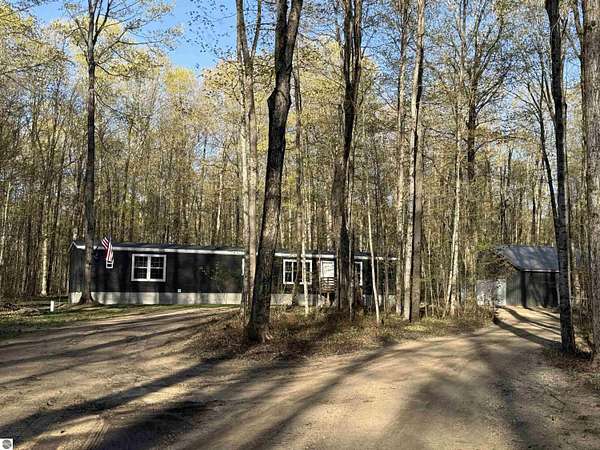 10 Acres of Recreational Land with Home for Sale in Mancelona, Michigan