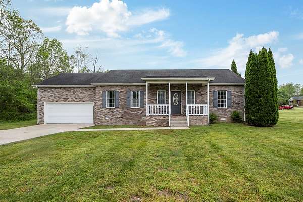 1.5 Acres of Land with Home for Sale in Burns, Tennessee