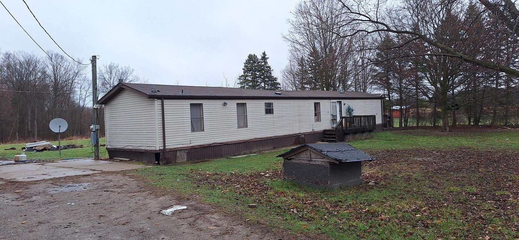 3.34 Acres of Land with Home for Sale in Sheridan, Michigan