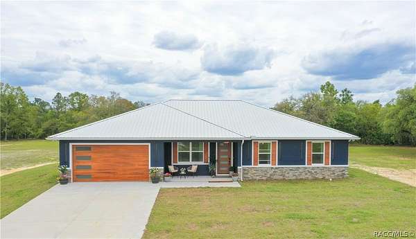 7.77 Acres of Land with Home for Sale in Dunnellon, Florida