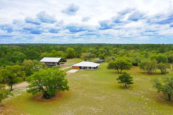 7.77 Acres of Land with Home for Sale in Dunnellon, Florida