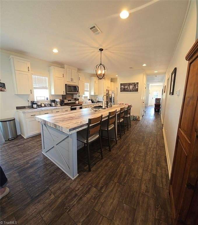 3.78 Acres of Land with Home for Sale in Siloam, North Carolina