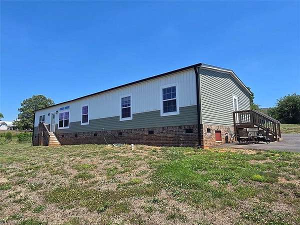 3.78 Acres of Land with Home for Sale in Siloam, North Carolina