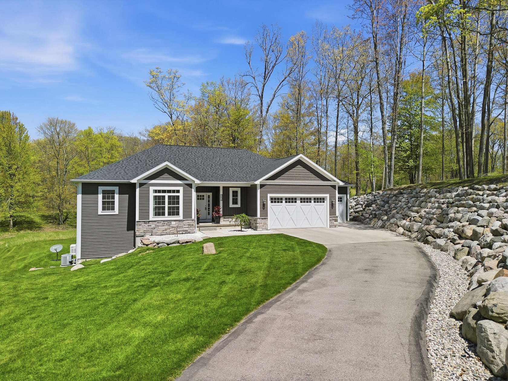 1.76 Acres of Land with Home for Sale in Canadian Lakes, Michigan