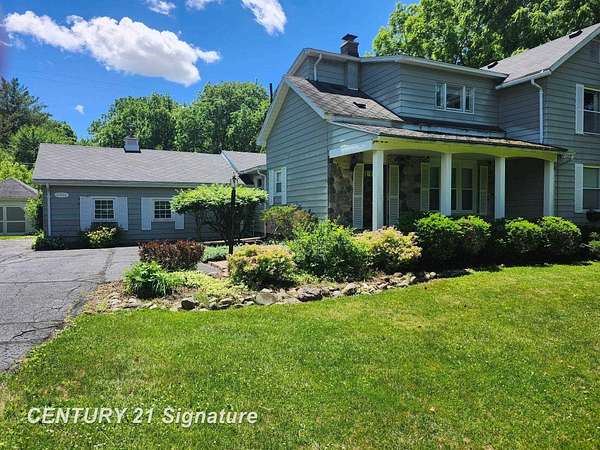 7.9 Acres of Land with Home for Sale in Flint, Michigan