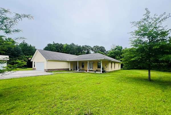7.8 Acres of Land with Home for Sale in Carriere, Mississippi
