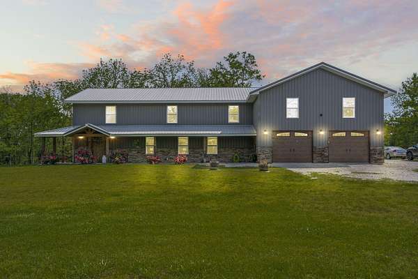 5.1 Acres of Land with Home for Sale in Lampe, Missouri
