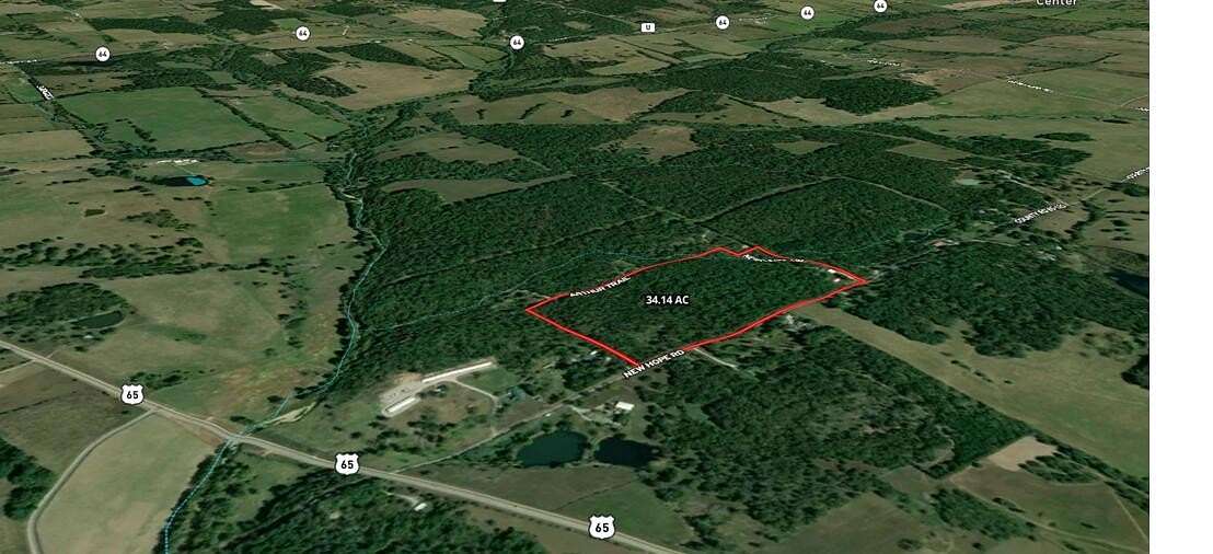 13.1 Acres of Land with Home for Sale in Louisburg, Missouri