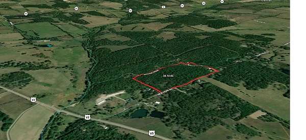 13.1 Acres of Land with Home for Sale in Louisburg, Missouri