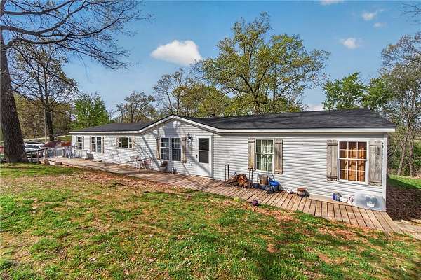 5.47 Acres of Land with Home for Sale in Rogers, Arkansas