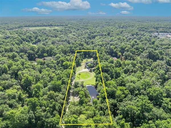 2.5 Acres of Land with Home for Sale in Oviedo, Florida