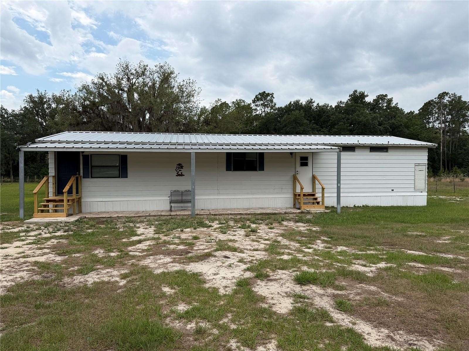1.64 Acres of Land with Home for Sale in Polk City, Florida