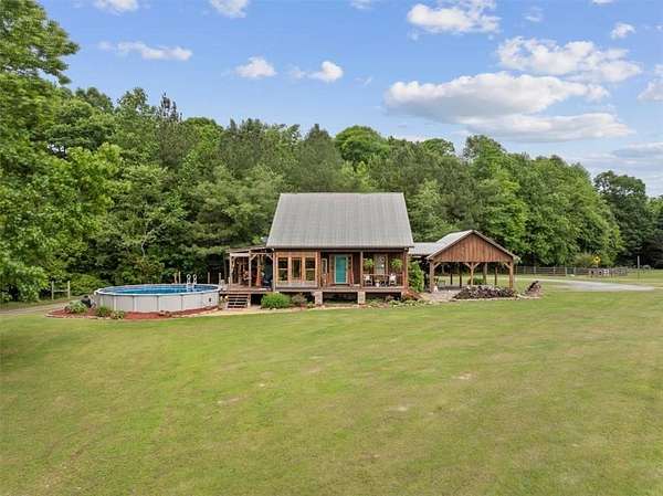 18.3 Acres of Land with Home for Sale in Plainville, Georgia