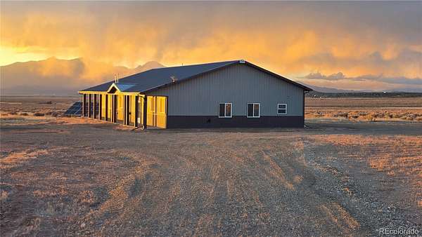 10 Acres of Land with Home for Sale in Fort Garland, Colorado