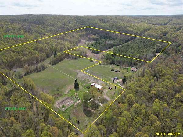 52.8 Acres of Land with Home for Sale in Boyne Falls, Michigan